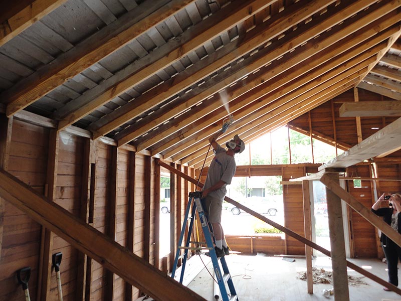 Installer spraying Radiant X